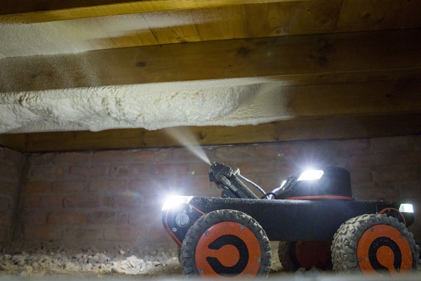 Robotic vehicle to insulate suspended timber floors 